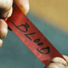 2goodarms: Close-up of a red slip of paper reading "BLOOD" (there will be)