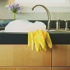 alwayswondered: Yellow rubber gloves next to a sink overflowing with bubbles. (domestic: takin' care of business)