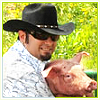 rikes: Chris Kirkpatrick holding a pig (Chris)