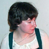 rosefox: Me looking down and sideways, firelight reflecting on my face. (sympathy)