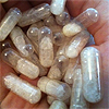 alwayswondered: A handful of transparent medication capsules with white contents. (fucking meds)