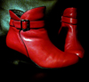 jamethiel: Red shiny ankle boots against a black background (shoes!)