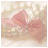 softness: pink ribbon on a pearl necklace (pearls)