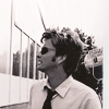 dreamtofbeing: David Tennant walking towards the camera, turned sideways. Wearing aviators. (aviators)