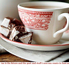 monanotlisa: a side view on a cuppa tea, white cup with red patterns, icon also has a border on the bottom like that (tea)