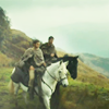 semielliptical: Marcus and Esca from The Eagle, on horseback in a mountainous landscape (journey)