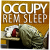 manifold: A picture of an OWS protester sleeping on a table under the words "OCCUPY REM SLEEP". (occupy rem sleep)