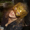 gblvr: photo of Greta wearing a gold mask and singing (THS -- Sing Greta Sing!)